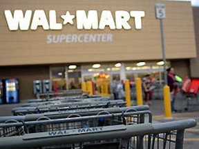 Wal-Mart's lengthy struggle to open in New York City has hit fresh problems - a controversial report that said America's biggest discounter does not just sell cheap, it makes neighborhoods poorer.