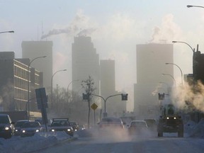 Exhaust fog covers the Winnipeg skyline early Tuesday, Jan. 18, 2011 as a cold snap continues to grip the city with a bitterly cold high pressure system set to stay for a few days. (MARCEL CRETAIN/Winnipeg Sun)