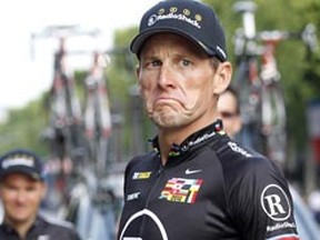 Lance Armstrong of the U.S. reacts on the Champs Elysees in Paris during the final parade of the 97th Tour de France cycling race July 25, 2010. (REUTERS/Francois Lenoir)