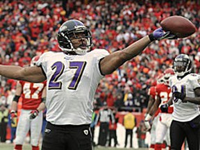 Ray Rice of the Ravens flips the ball into the air after scoring the go-ahead touchdown late in the first half on Sunday in K.C. The Ravens went on to win 30-7. (REUTERS)