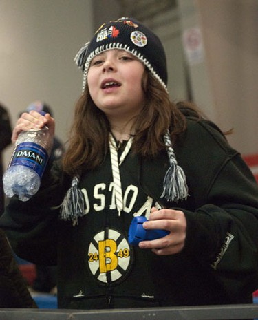 OTTAWA, Ont. (01/01/11)-- Jessica Hopkins cheers as her brother, Tommy, of the Assabet Valley Patriots, competes in the minor atom AAA skills competition in the Jim Durrell COmplex during the Bell Capital Cup. Photo by Hadas Parush.