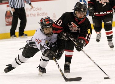 OTTAWA, Ont. (03/01/11)-- Beijing Little Wolf's Yihan Wang and Almonte Thunder's Wesley Jones collide in the Atom House A championship game on Monday in Scotiabank Place during the Bell Capital Cup. The Beijing Little Wolf won the championship with a score of 5-1. Photo by Hadas Parush.