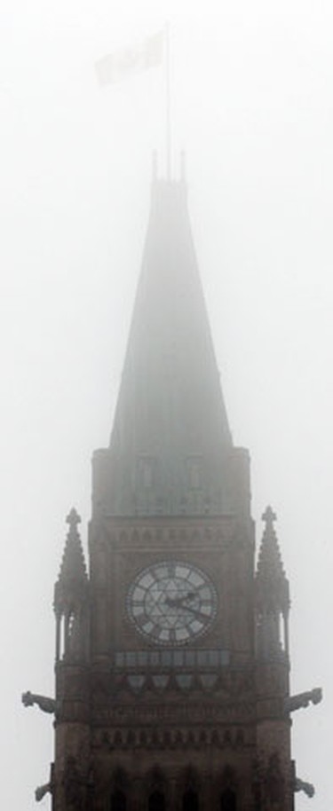 Dense fog shrouds Parliament Hill in Ottawa Saturday, January 1, 2011. The temperature was only a few degrees shy of breaking a 45-year-old-record. (Darren Brown/Ottawa Sun)