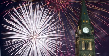 Fireworks go off behind the Peace Tower on Canada Day Thursday, July 1, 2010.  (DARREN BROWN/QMI Agency)