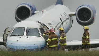 Two people have been injured after a United Express jet slid off a runway this afternoon at Ottawa Airport. The plane slid off the end of the runway during heavy rain at about 2:30 p.m., as it was attempting to land. Flight 8050 from Washington contained 39 people, believed to be 36 passengers and three crew, though the Sun has received conflicting reports on the number of passengers.  Tony Caldwell/QMI Agency