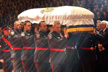 Pallbearers carry the casket of Ottawa police Constable Eric Czapnik during a funeral ceremony in Ottawa January 7, 2010. Constable Czapnick was killed while on duty outside the Ottawa Civic Hospital December 29, 2009.   Tony Caldwell/Ottawa Sun