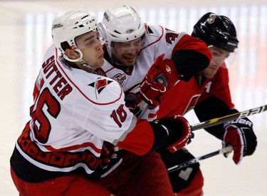 Carolina Hurricanes' Brandon Sutter (16) and Patrick Dwyer (39) collide while trying to check Mike Fisher (12) during the third period of NHL action at Scotiabank Place Wednesday, December 29, 2010. Hurricanes shut out the Sens 4-0.  (Darren Brown/Ottawa Sun)