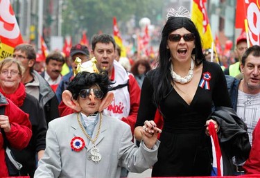 Demonstrators portraying France's President Sarkozy and wife Carla take part in the "No to austerity" protest to demand better job protection in Brussels on Sept. 29, 2010.  About 100,000 people took to the streets of the Belgian capital in protest against the cost-cutting measures of euro zone governments. (REUTERS)