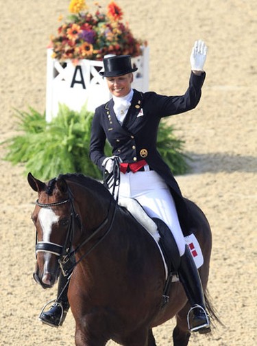 Anne Van Olst of Denmark riding Exquis Clearwater competes in the World Dressage Championship at the World Equestrian Games in Lexington, Kentucky, September 28, 2010.    REUTERS/John Sommers  II