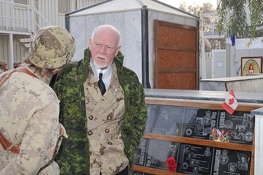 Hockey icon Don Cherry chats with troops during a surprise visit to Afghanistan on Christmas Day. (CANADIAN ARMED FORCES)