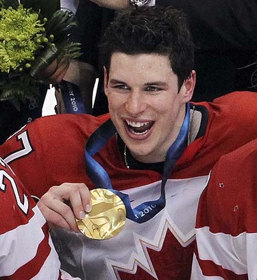 Sidney Crosby poses with his medal after Canada wins the gold medal in men's Olympic hockey in Vancouver, B.C., on Sunday, Feb. 28, 2010. ANDRE FORGET/QMI AGENCY