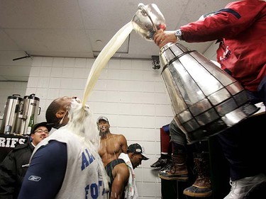 Montreal Alouette Raymond Fontaine gets a drink after winning the 98th Grey Cup held Edmonton, Sunday November 28, 2010. PERRY MAH/QMI AGENCY