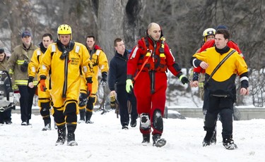 Emergency Services personnel leave the scene at Strathcona Park where efforts were made to rescue a nine year old boy from the Rideau River. Tuesday December 21,2010. (ERROL MCGIHON/THE OTTAWA SUN)