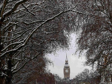 The Houses of Parliament are seen through snow covered trees in London on Dec. 18, 2010. Fresh snow brought much of Britain to a standstill on Saturday, on what is traditionally the busiest weekend for shopping and travel in the run-up to Christmas. (REUTERS)
