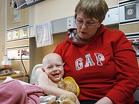 Cynthia Haas and her son Jaxin Albersworth pose for a photo in Jaxin's hospital room at the Stollery Children's Hospital in Edmonton, Dec. 4. DAVID BLOOM/QMI AGENCY