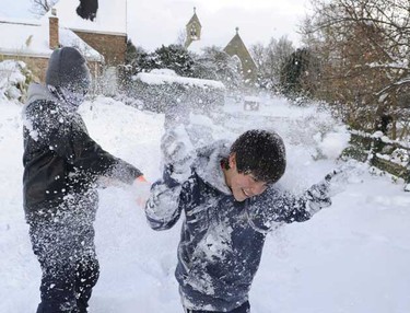 Youths throw snowballs in Stamford Bridge, northern England on Thursday. Heavy snow caused travel chaos across much of northern Europe on Thursday, keeping London's Gatwick airport closed for a second day and disrupting road and rail travel in France, Germany and Switzerland. (REUTERS/Nigel Roddis)