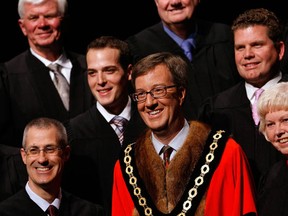Jim Watson poses with the members of the   2010-2014 City of Ottawa Council during the inauguration ceremony  at the Shenkman Arts Centre in Orleans Wednesday, December 1, 2010. (Darren Brown/Ottawa Sun)