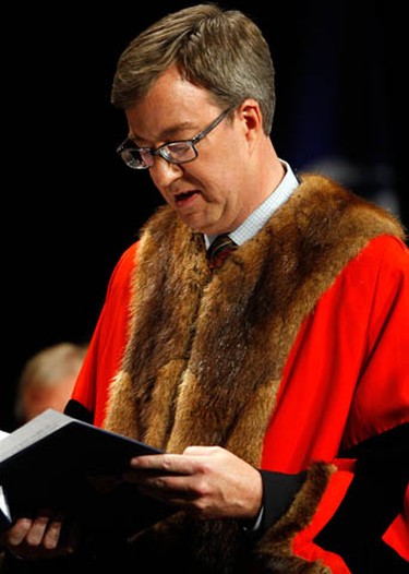 Jim Watson reads the oath during the inauguration ceremony for the 2010-2014 City of Ottawa Council at the Shenkman Arts Centre in Orleans Wednesday, December 1, 2010. (Darren Brown/Ottawa Sun)