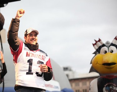 The Grey Cup parade made its way down Ste-Catherine street Wednesday as Alouettes players greeted thousands of fans. (Philippe-Olivier Contant/QMI AGENCY)