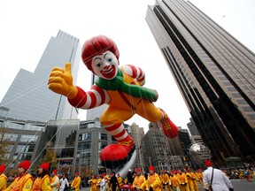 The Ronald McDonald balloon floats through Columbus Circle during the 84th Macy's Thanksgiving day parade in New York November 25, 2010.  REUTERS/Brendan McDermid