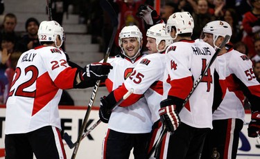 Ottawa Senators' Nick Foligno (71), center, is congratulated by teammates, Chris Kelly (22), left, Chris Neil (25), Chris Phillips (4) and Sergei Gonchar (55) after scoring his first goal of the season against goalie Martin Gerber (29) of the Edmonton Oilers during the first period of NHL action at Scotiabank Place Monday, November 29, 2010.  (Darren Brown/Ottawa Sun)
