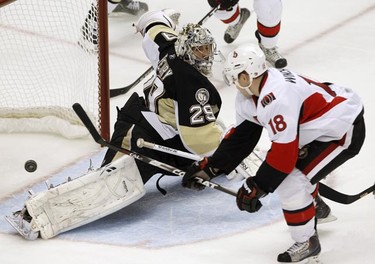 Pittsburgh Penguins goalie Marc-Andre Fleury (29) blocks a shot by Ottawa Senators' Jesse Winchester (18) in the second period of their NHL hockey game in Pittsburgh, Pennsylvania, November 26, 2010. REUTERS/Jason Cohn