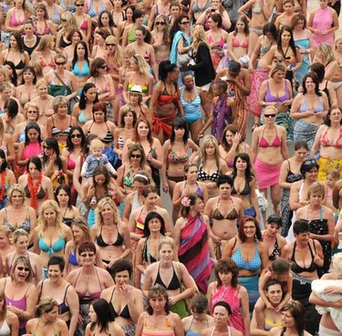 The Nashua Largest Ever Bikini Parade in Port Elizabeth, South Africa saw 605 enthusiastic participants braving the rain and walking a distance of more than one mile .99 miles (1.6 kilometers) around the Nelson Mandela Bay Stadium - setting the new Guinness World Record for the largest bikini parade while raising awareness of cancer and funds for the Cancer Association of South Africa. (Pro Design Photographers/WENN.com)