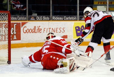 Ottawa 67s' Ryan Martindale (77) beats Sault Ste. Marie Greyhounds' goalie, Chris Perugini (35) to open the scoring during the first period of OHL action at the Civic Centre Sunday, November 14, 2010.   (Darren Brown/Ottawa Sun)