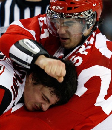 Ottawa 67s' Julian Luciano (25) fights Sault Ste. Marie Greyhounds' David Quesnele (23) during the second period of OHL action at the Civic Centre Sunday, November 14, 2010.  David Quesnele (23) hurt his shoulder in the fight.  (Darren Brown/Ottawa Sun)