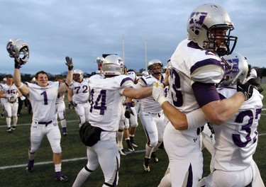 University of Western Ontario Mustangs' John Leckie, jumps into the arms of teammate, Jamie Symianick after beating the University of Ottawa GeeGees in the OUA Championships at Frank Clair Stadium Saturday, November 13, 2010. (Darren Brown/Ottawa Sun)