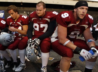 From left, University of Ottawa GeeGees' Chris Daly, Kevin Magee and Matthew Bolduc react after losing to the University of Western Ontario Mustangs' in the OUA Championships at Frank Clair Stadium Saturday, November 13, 2010. (Darren Brown/Ottawa Sun)