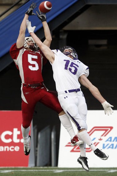 University of Ottawa GeeGees' Steven Hughes (5) can't complete the reception while defended by University of Western Ontario Mustangs' Craig Butler (15) during the second half of the OUA Championships at Frank Clair Stadium Saturday, November 13, 2010. (Darren Brown/Ottawa Sun)