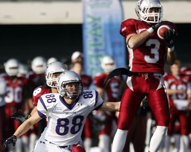University of Ottawa GeeGees Lee Shaver (3) intercepts a pass intended for University of Western Ontario Mustangs' Nick Trevail (88) during the first quarter of action at Frank Clair Stadium in the Yates Cup Saturday, November 13, 2010.  (Darren Brown/Ottawa Sun)