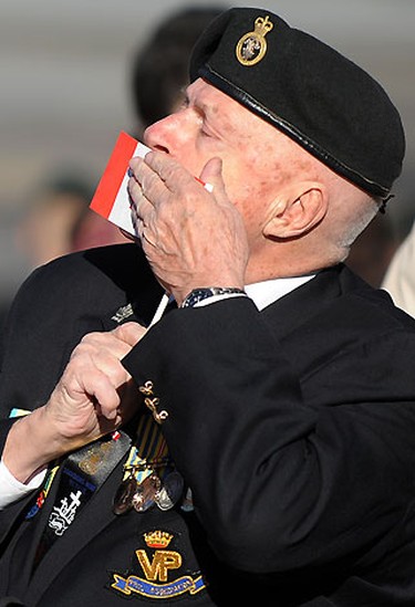A powerful image of an unnamed French war veteran kissing a Canadian flag at a Remembrance Day ceremony in Quebec is this week's winner. Photographer Jean Francois Desgagne saw flags being distributed among waiting veterans at the ceremony and focused his camera on one of them, not expecting the emotional outburst he saw through his viewfinder. The man repeatedly kissed the flag and proudly exclaimed his love for his country as the photographer snapped his shutter. Anticipation and timing are the photographer's friend and paid off in this case with our best QMI photo of the week.