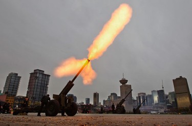 Members of the 15th Field Royal Canadian Artillery fire their gun during Remembrance Day Ceremonies on the waterfront in Vancouver, November 11, 2010.  REUTERS/Andy Clark