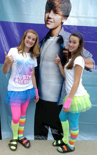 Fans Harlee Bugg left and Kristen Nelson both 13 of Peterborough were dressed to attract the attention of Justin Bieber.  They did see him and were able to snap a picture.  SUE REEVE The London Free Press