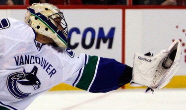Vancouver Canucks' Roberto Luongo (1) makes a glove save during the first period of NHL action at Scotiabank Place Thursday, November 11, 2010. (Darren Brown/Ottawa Sun)