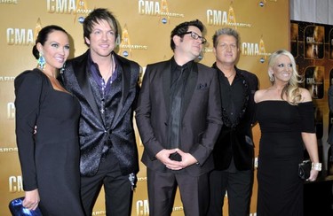 The members of the group Rascal Flatts and their guests arrive at the 44th annual Country Music Association Awards in Nashville, Tennessee, November 10, 2010.    REUTERS/Tami Chappell