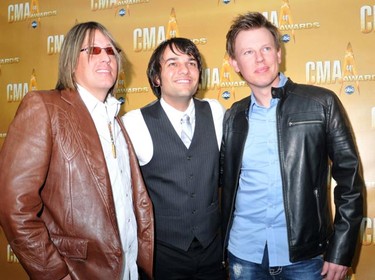 Members of Due West, Matt Lopez (C), Tim Gates (L) and Brad Hull, arrive at the 44th annual Country Music Association Awards in Nashville, Tennessee, November 10, 2010.     REUTERS/Tami Chappell