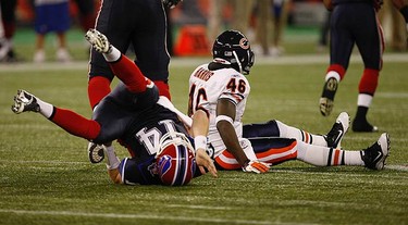Bills quarterback Ryan Fitzpatrick gets dumped by Chicago's Chris Harris. The Buffalo Bills and the Chicago Bears played an NFL game at the Rogers Centre in Toronto on Nov. 7, 2010. The Bears won 22-19. (CRAIG ROBERTSON, Toronto Sun)