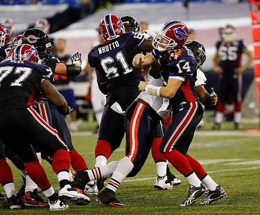 Bills quarterback Ryan Fitzpatrick throws under pressure and gets intercepted on their final possession. The Buffalo Bills and the Chicago Bears played an NFL game at the Rogers Centre in Toronto on Nov. 7, 2010. The Bears won 22-19. (CRAIG ROBERTSON, Toronto Sun)
