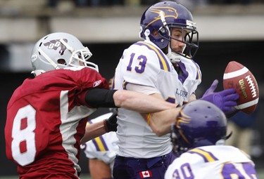 Nov 6/2010 The Ottawa Gee-Gees took on the Wilfrid Laurier Golden Hawks during the OUA semi-final at Frank Clair Stadium Sunday afternoon. Golden Hawk Giancario Rapanaro tries to grab the football during first half action.   Tony Caldwell/Ottawa Sun