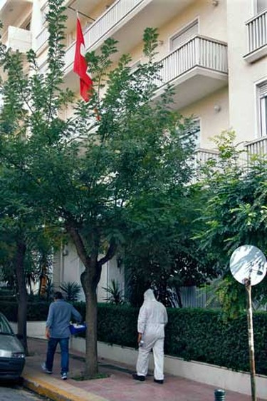 Investigators arrive at the Swiss Embassy in Athens after a bomb alert Nov. 2, 2010. A bomb went off on Tuesday at the Swiss embassy in Athens but there were no immediate reports of injuries, Greek police officials said. (REUTERS)