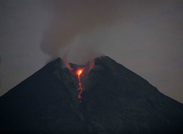 Lava flows from Mount Merapi volcano as seen from Balerante village in Klaten, near the ancient city of Yogyakarta, on Oct. 31, 2010. Indonesia's Mount Merapi erupted again on Saturday morning, spewing ash into the sky, and prompting authorities to extend the danger radius by two kilometres. (REUTERS)