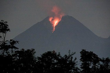 Lava flows from Mount Merapi volcano as seen from Sidorejo village in the district of Klaten, central Java, on Oct. 31, 2010. Indonesia's Mount Merapi erupted again on Saturday morning, spewing ash into the sky, and prompting authorities to extend the danger radius by two kilometres. (REUTERS)