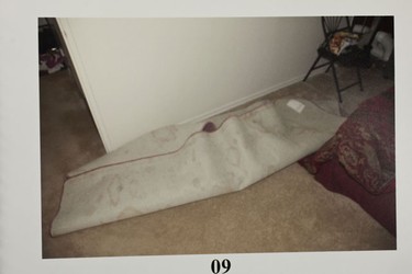 Demetrios Angelis murder trial evidence photos showing the rolled-up carpet.