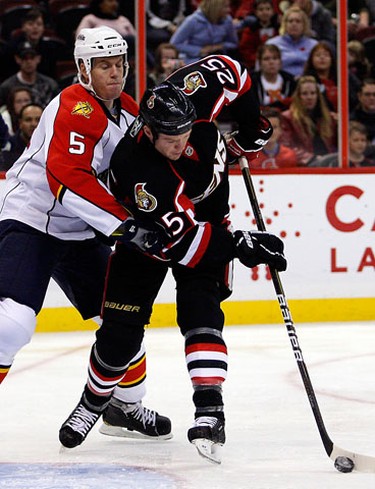 Ottawa Senators' Chris Neil (25) looks for the puck while Florida Panthers' Bryan Allen (5) defends in front of his net during the first period of NHL action at Scotiabank Place Thursday, October 28, 2010. (Darren Brown/Ottawa Sun)