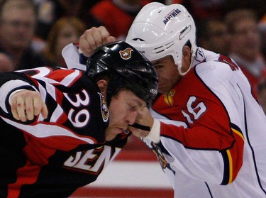 Ottawa Senators Matt Carkner (39) fights Florida Panthers' Darcy Hordichuk (16) during the second period of NHL action at Scotiabank Place Thursday, October 28, 2010. (Darren Brown/Ottawa Sun)