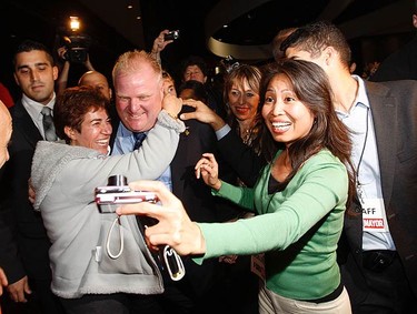Mayor-elect Rob Ford is swarmed by supporters as he makes his way to the podium to give his victory speech on Oct. 25, 2010. (MIKE PEAKE, Toronto Sun)