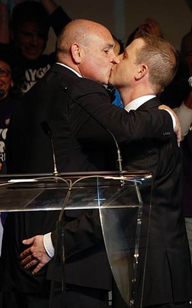 George Smitherman is greeted by his husband after conceding to Mayor-elect Rob Ford in Toronto on Oct. 25, 2010. (JACK BOLAND, Toronto Sun)